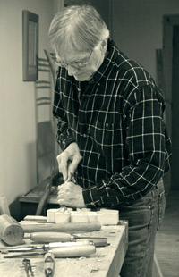 John Bailey at work in his furniture shop in Lima, New York