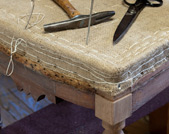 John Bailey specializes in upholstery of heirloom pieces at his shop in Lima, New York